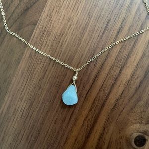 Genuine aquamarine gemstone, unpolished, on gold chain. Come with jewelry pouch